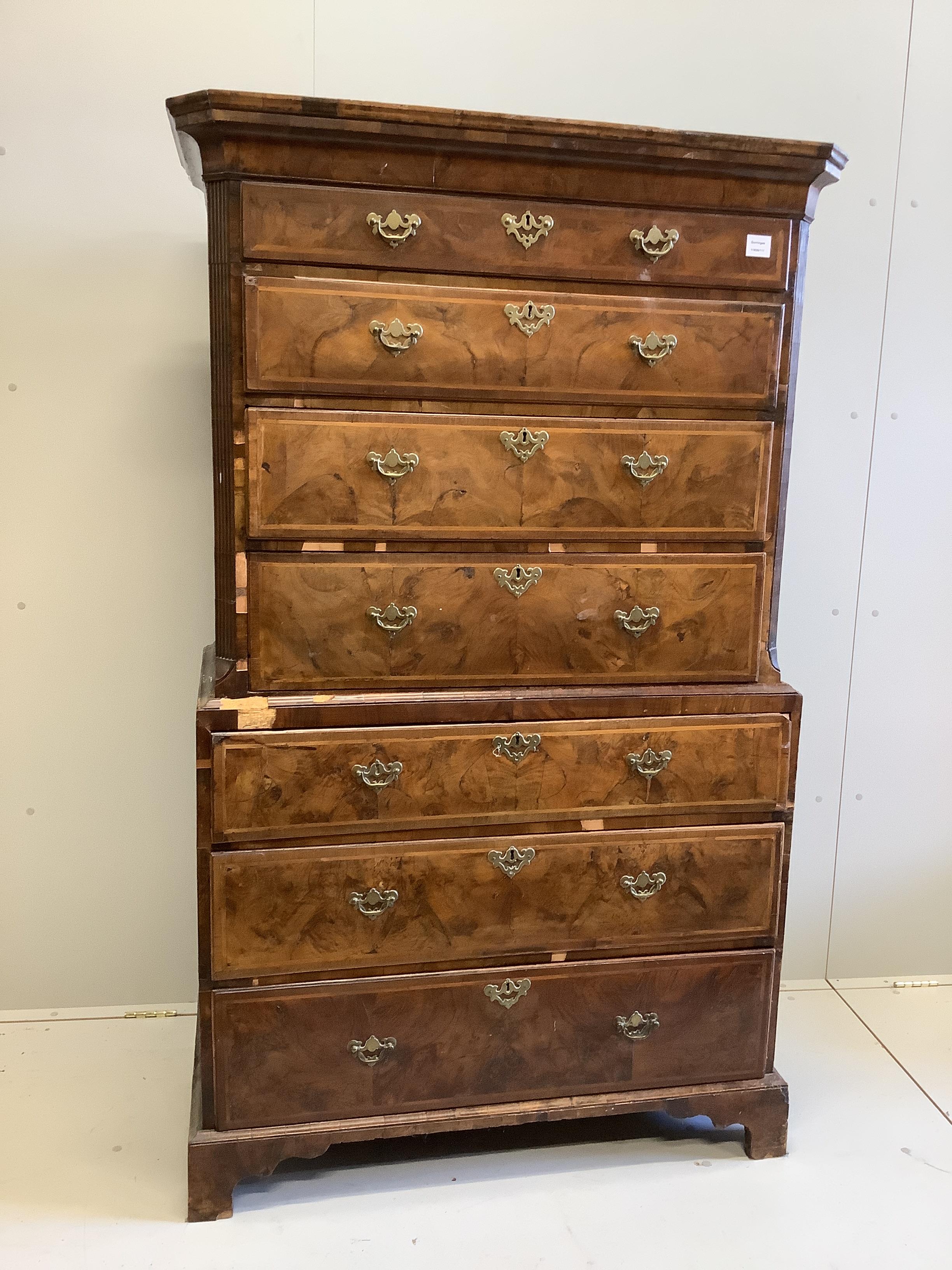 An 18th century feather banded walnut chest on chest, width 101cm, depth 52cm, height 173cm